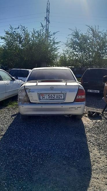 e6 3: Mazda Familia: 2002 г., 1.6 л, Автомат, Бензин, Седан — 3