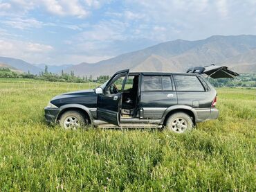 уна тетиктери: Внедорожник SsangYong Musso черного цвета
