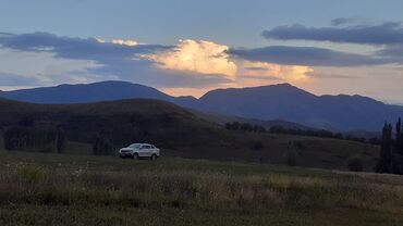 кофр на крышу автомобиля: Пикап SsangYong Rexton Sports выполнен в серебристом цвете, что