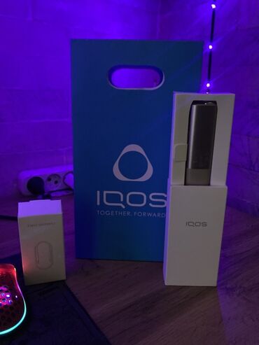 IQOS tütün qızdırıcı sistemi. Cihaz tütün çubuqlarını yandırmadan