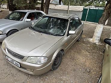 пленка авто: Mazda 323: 1998 г., Механика, Бензин, Седан — 1