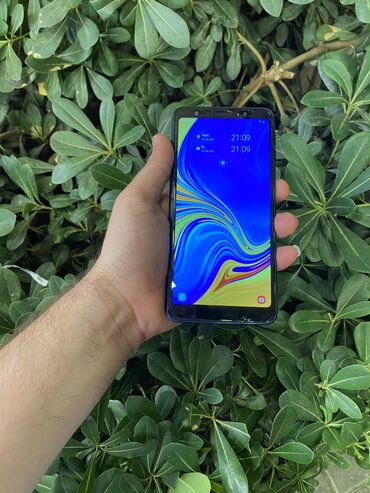 samsung c170 купить: Samsung Galaxy A7 2018, 128 ГБ, цвет - Синий, Сенсорный, Отпечаток пальца, Беспроводная зарядка