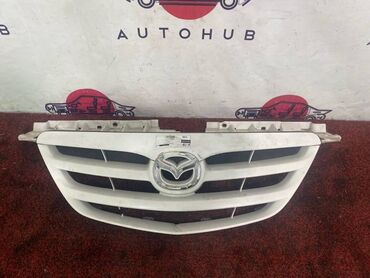 Решетки, облицовки: Решетка радиатора Mazda Б/у, Оригинал