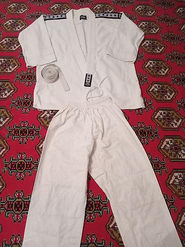 Kişi geyimləri: Judogi (cüdo geyimi) dəsti - Rəng: ağ - Komplekt: üst (gi), şalvar və — 2