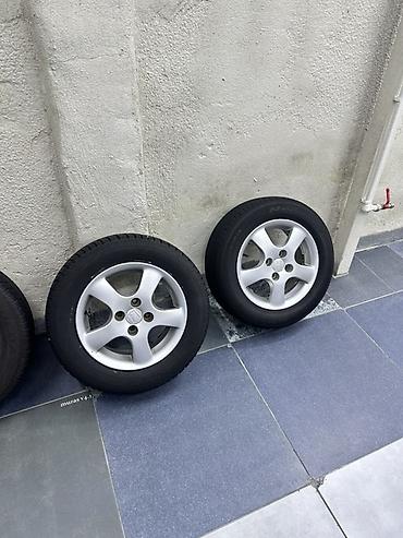 r15 100 4: Комплект из 4 колес в сборе: литые диски + шины. - Диски — 2
