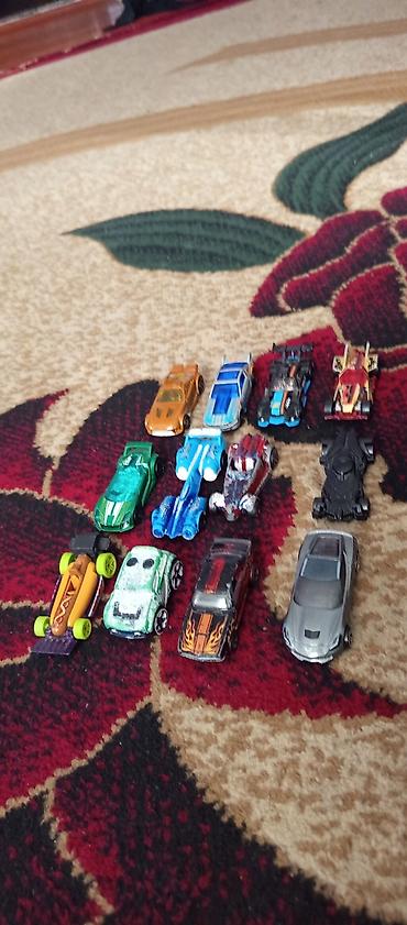 Digər oyuncaqlar: 2 çi şəkildə kiler hot wheels firmasinidir içində yolda var yolun özü — 2