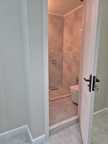 Təmir işləri: - Daxili dizayn: açıq-boz və ağ tonlarda müasir üslub, hamar divar — 6