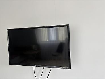 ТВ и видео: Телевизор LG, диагональ около 32–37" (по габаритам на стене). Плоская — 3