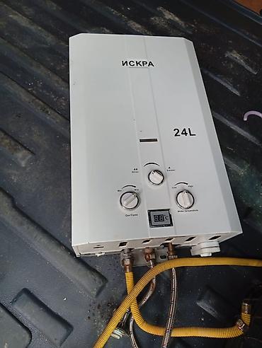 philips xenium x703: İSKRA 24L qazla işləyən axın tipli su qızdırıcısı - Tutum: 24 L/dəq — 1