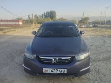 купить шины бу в бишкеке: Минивэн Honda Odyssey темно-серого цвета, представленный на