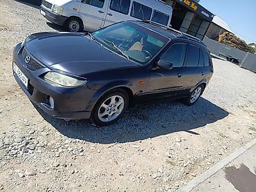 бишкек авто салон: Mazda 323: 2002 г., 2 л, Автомат, Бензин, Хетчбек — 10