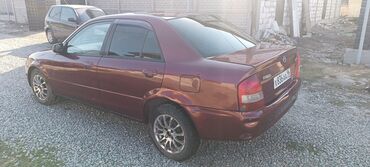 дешевые машины: Mazda Familia: 2002 г., 1.5 л, Автомат, Бензин, Седан