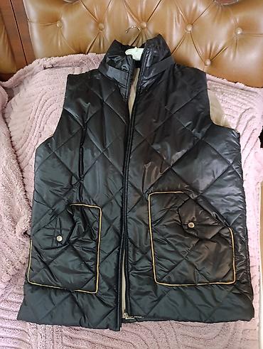 heri bezekleri: Qadın üçün yastı tikişli, qara rəngli quilted jilet. - Material — 1