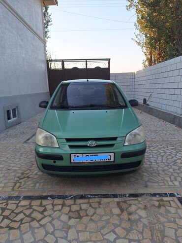 купить бампер на форд мондео 3: Автомобиль Hyundai Getz зеленого цвета, компактный хэтчбек. Модель