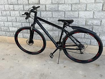 hybrid bicycle: Fars velosiped markasının qara rəngli dağ velosipedi. Velosipedin — 2