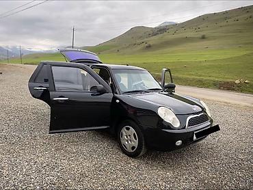 LIFAN: Lifan 320, 5 qapılı kompakt hetçbek. Xarici: - Qara rəng, xrom qapı — 2