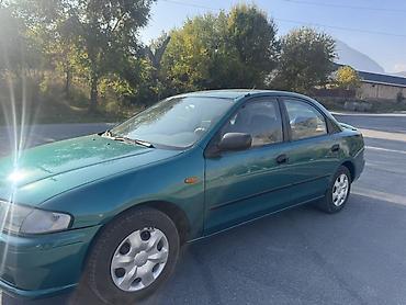 плуг для мтз трактора: Mazda 323: 1997 г., Механика, Бензин, Седан — 8