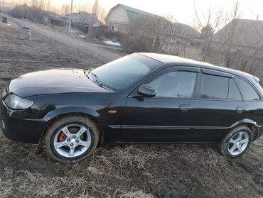 Mazda: Mazda 323: 2002 г., 1.6 л, Механика, Бензин, Купе