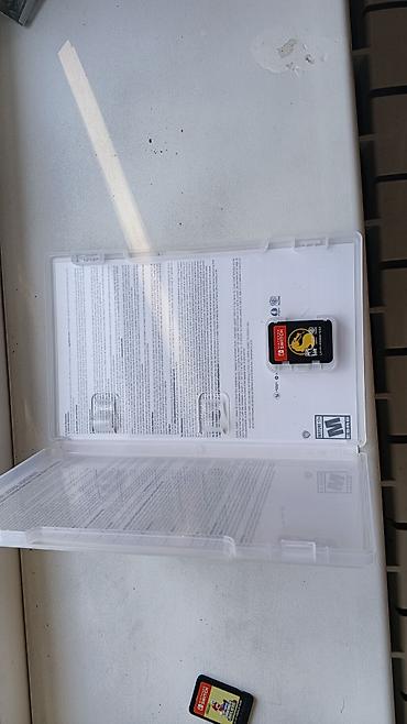 nintendo dsi: Nintendo Switch üçün oyun kartricləri və qutu təqdim olunur. Dəstə — 2