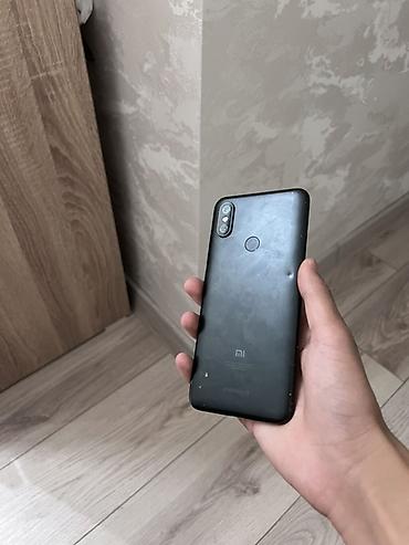 Смартфон Xiaomi (линейка Mi/Redmi), черный корпус. Характеристики по