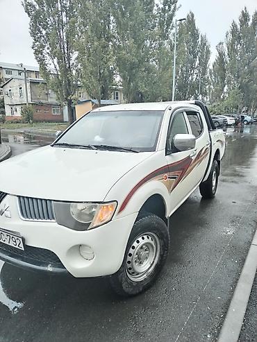 235 55 18: Mitsubishi L200: 2.4 l | 2008 il 302118 km Pikap — 5