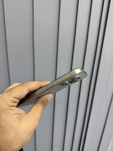 data modem: IPhone 15 Pro, 128 GB, Natural Titanium, Face ID — 7
