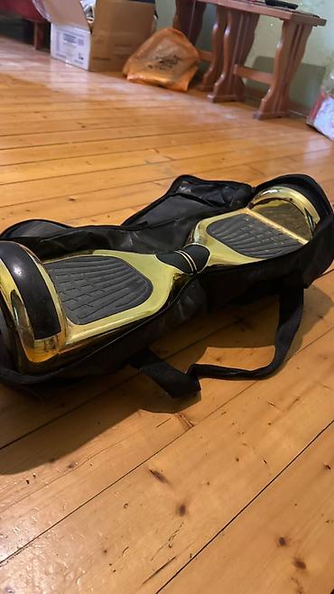 Giroskuterlər: Qızılı rəngdə iki təkərli hoverboard (self-balance skuter) — 2