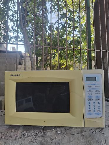 Mikrodalğalı sobalar: Sharp mikrodalğalı soba - Rəng: krem-sarı korpus, qara şüşə qapı - Ön — 1