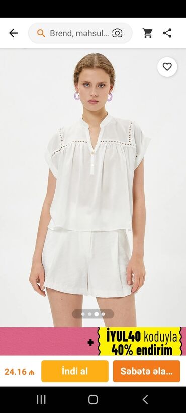 Futbolka və maykalar: Ağ rəngli, qısaqol qadın bluzası. Bluzanın yaxası V formalıdır və — 9