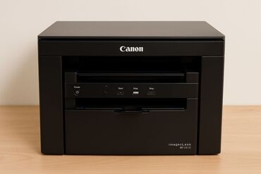 Darvazalar: Qara rəngdə olan Canon ImageClass MF261D printeri. Bu printer ofis və
