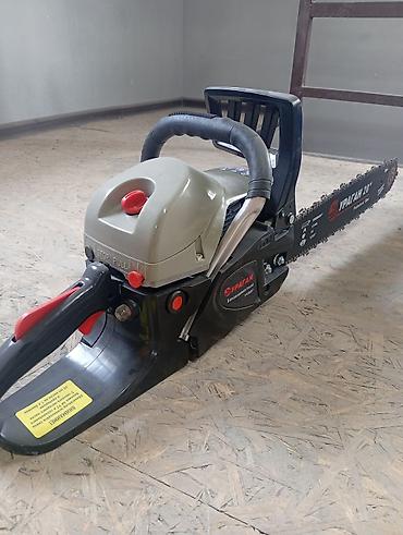 ниже: Бензопила Ubay Tools UB-520 - Тип: бензиновая цепная пила, 2‑тактный — 5