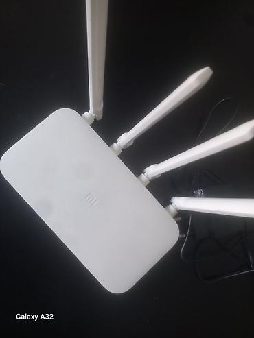 Modemlər və şəbəkə avadanlıqları: Xiaomi Mi Wi‑Fi Router (4 antennali) + TP‑Link ADSL/VDSL modem-router — 2