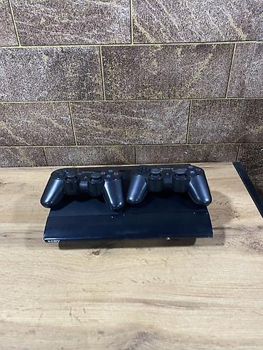 Игровая приставка Sony PlayStation 3 Super Slim (черная) с двумя at lalafo.kg Игровая приставка Sony PlayStation 3 Super Slim (черная) с двумя