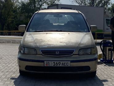 срочно продаю хонда стрим: Минивэн Honda Odyssey 1999 года, золотистого цвета, предназначенный