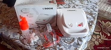 tibb geyimi: L’DOCILE inhalyator/nebulayzer cihazı. Komplektdə görünən hissələr: - — 1