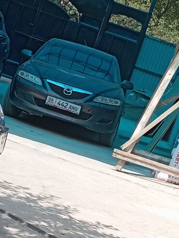 машины 2023: Автомобиль Mazda 6 первого поколения, модель GH, представлен в сером