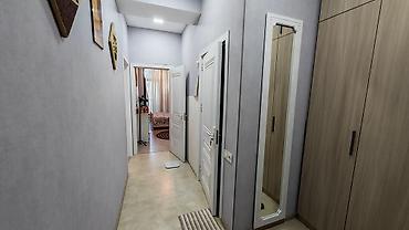 memar ecemi ev alqi satqisi: Satılır: işıqlı və zövqlə dizayn edilmiş 2 otaqlı mənzil (studia tipli — 4