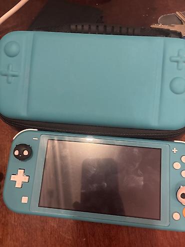 nintendo switch 3 lite: Nintendo switch lite üzerinde cantası. hic bir problemi yoxdu — 4