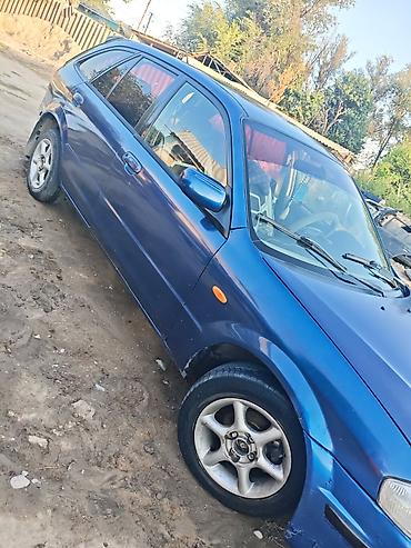 х трейл: Mazda Familia: 2000 г., 1.5 л, Механика, Бензин, Хэтчбэк — 5