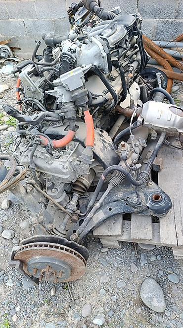 Двигатели, моторы и ГБЦ: Двигатель в сборе с подрамником и подвеской Описание: - Бензиновый — 9