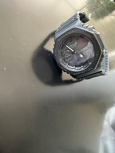 Наручные часы: G-SHOCK GA-2100 seriyasından olan bu saat, hərbi üslublu mat qara — 2