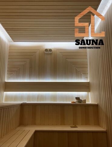 Santexnik işləri: Taxta panellərlə işlənmiş daxili sauna. Divarlar və tavan açıq rəngli