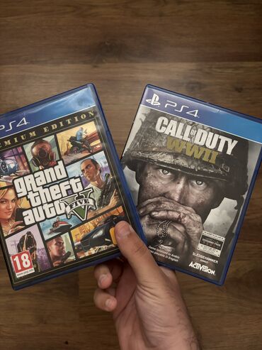 Oyun diskləri və kartricləri: Ps4 üçün Call of Duty WW2 və GTA 5 premium edition. 2-3 dəfə