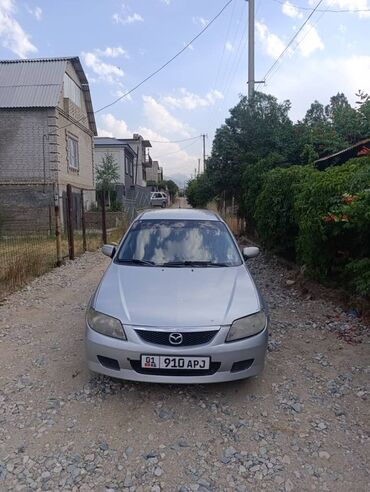 киа к5 2019 цена бишкек: Автомобиль Mazda 323, представленный в серебристом цвете, является