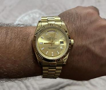 saat omega: Rolex Oyster Perpetual Day‑Date qol saatı - Korpus və qolbaq: sarı — 1