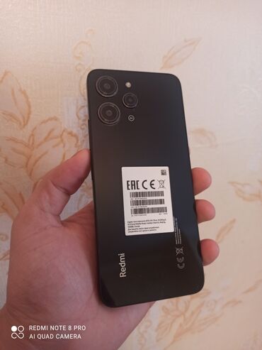 islenmis telefon alisi: Xiaomi Redmi 12, 128 GB, rəng - Qara, 
 Zəmanət, Barmaq izi, İki sim kartlı