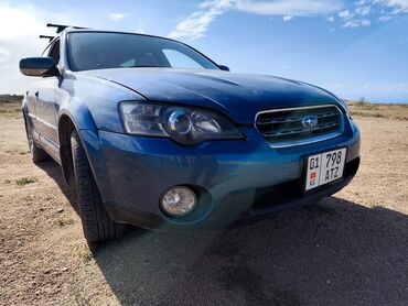 sagem myx 1 twin: Автомобиль Subaru Outback синего цвета, с рейлингами на крыше