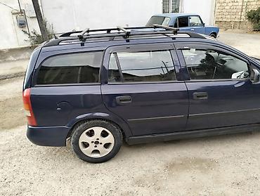 prius baqaj: Opel Astra Caravan (universal) – tünd mavi rəng. Xüsusiyyətlər: - — 3