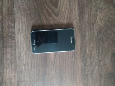 что такое бу телефон: Samsung Galaxy J1 Duos, Б/у, цвет - Черный, 2 SIM