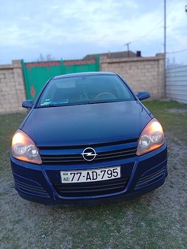 Opel: Opel Astra H, göy rəng, heçbek kuzov. Texniki xüsusiyyətlər: - Ön — 1